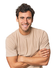 Fototapeta premium Young Hispanic man in studio laughing and having fun.