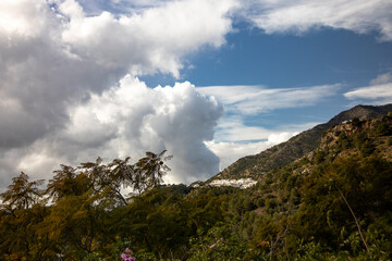 Mountainous village in Mediterranean Spanish Andalusian coastline. Costa del Sol town engulfed by...