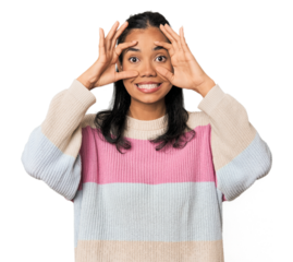 Young Filipina woman keeping eyes opened to find a success opportunity.