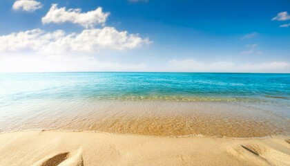 Obraz premium Summer background of beach sand in the foreground and sea in the background
