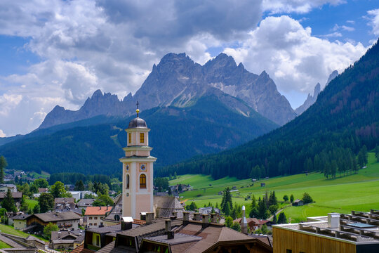Scenic view of Sexten village with church and Dolomites in Southern Tyrol, Italy