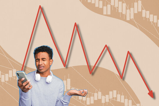 Shocked young man with headphones looking at smartphone with declining stock market chart in background