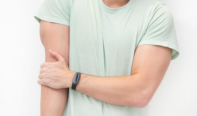 The man suffers from severe pain in his elbow