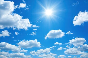 Bright Sunlight Shining Through White Clouds in Blue Sky Background