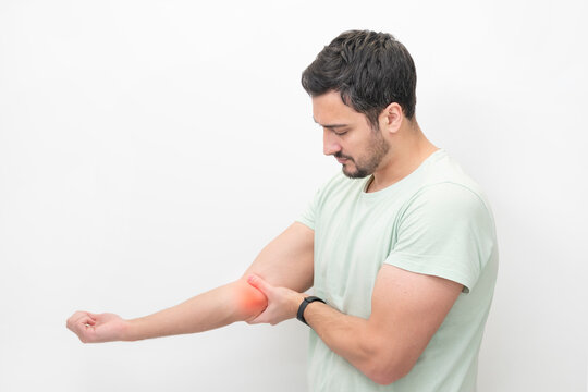 The man suffers from severe pain in his elbow