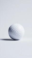 White golf ball on a smooth surface with soft shadows and subtle lighting