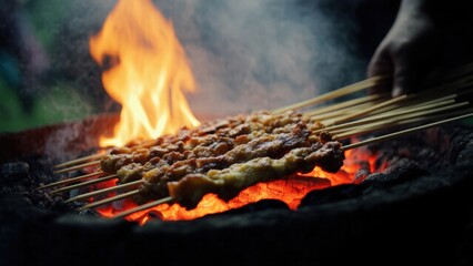 Street Food Vendor Grilling Skewers Over Open Flame
