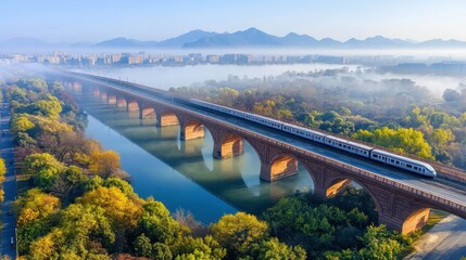 Obraz premium High-speed train journey across a scenic bridge landscape view morning fog over river nature's beauty