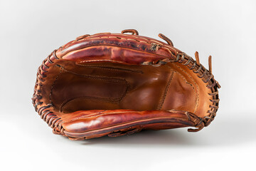 Old leather baseball glove brown designed for catching displayed on white background with light shadow. Show texture and craftsmanship perfect for sport equipment photography product advertising.
