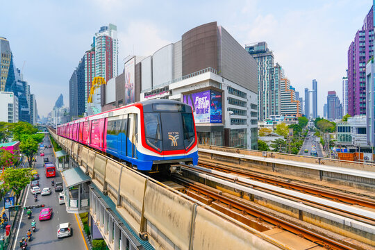 View of Bangkok skyline and skyscraper with BTS skytrain BTS sky train runs through the station Asoke Phrom Phong Thailand. 03 march 2024