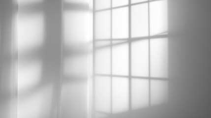 Shadows of window panes on white wall