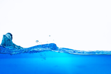 Closeup view of dynamic flowing blue water waves on white background. Liquid splash. Texture and abstract background