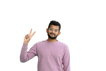 A man, on a white background, in close-up, shows a victory sign