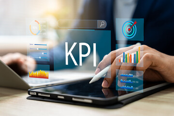 Analytics dashboard of key performance indicator (KPI), Businessman using KPI dashboard, Management data system connected to database for tracking earnings, operations,Sales data financial analytics