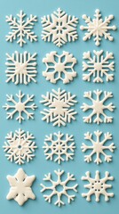 Fototapeta premium White Snowflakes on Light Blue Background