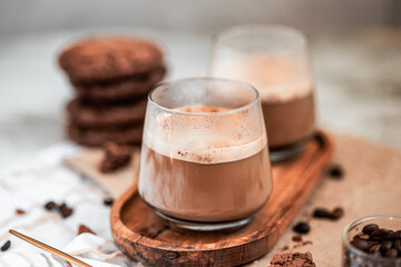 coffee with foam in a glass, two drinks, golden spoon, coffee beans, Americano, cappuccino, mocha, homemade pastries, cooking, chocolate cookies, light composition, macro, flatlay, coffee with sweets