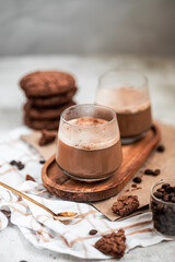 coffee with foam in a glass, two drinks, golden spoon, coffee beans, Americano, cappuccino, mocha, homemade pastries, cooking, chocolate cookies, light composition, macro, flatlay, coffee with sweets