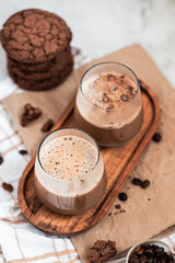 coffee with foam in a glass, two drinks, golden spoon, coffee beans, Americano, cappuccino, mocha, homemade pastries, cooking, chocolate cookies, light composition, macro, flatlay, coffee with sweets