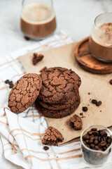 American chocolate chip cookies with coffee, handmade cookies, homemade baking, kraft paper, cookie packaging, macro cookie texture, warm light composition, selected focus, still life, food photograph