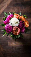 a bouquet of peonies on a table