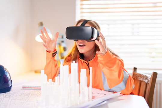 Virtual reality training session takes place in a bright office with a young woman practicing architecture skills while wearing a headset