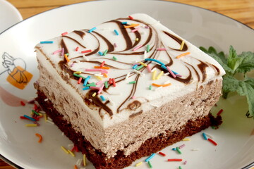 There is a large piece of cake on the plate.