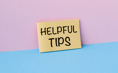 A yellow sticky note with the word Helpful Tips written on it