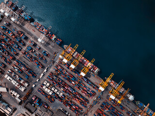 container ship and commercial port in deep sea load and unloading cargo from container ship import...