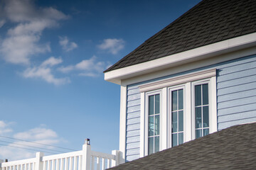 Bright blue sky and beautiful blue house buildings, morning sunlight.