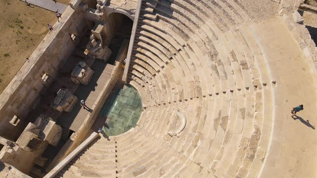 Aerial: ancient amphitheater in the ancient ruined Lycian city of Patara