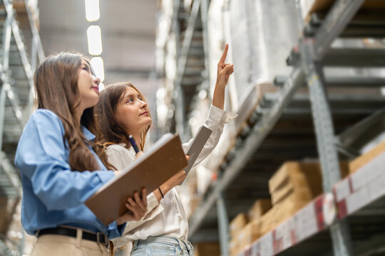 Female engineers team discussing inventory in warehouse logistics and supply chain planning, operation management, data analysis, warehouse shipping, inventory tracking, optimization and technology