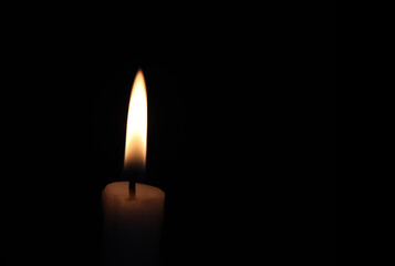 Close-up of a candle in the dark