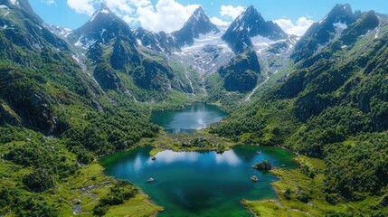 Fototapeta premium Mountain lake aerial view, glacial peaks, lush valley