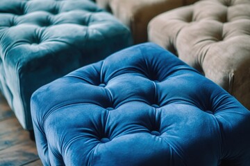 Fototapeta premium A close-up shot of a blue ottoman sitting on a wooden floor