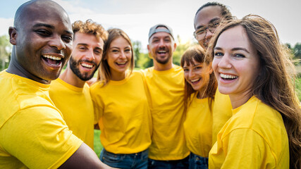 Multiracial group of people hugging outdoors - Happy friends having fun hanging outside - Youth community concept with guys and girls supporting each other