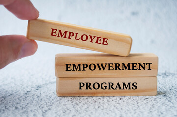 Employee Empowerment Programs text on wooden blocks. Employee empowerment concept