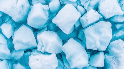 Obraz premium Fresh Blue Ice Cubes on Water Surface in Natural Light, Aerial Top View