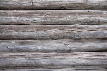 The photo shows old logs in close-up