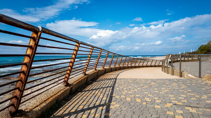 Obraz premium Coastal Walkway, wooden bridge over the sea