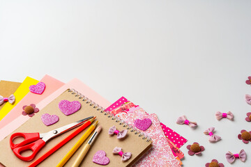Crafting supplies and materials arranged for creative projects on a tabletop in a bright and...
