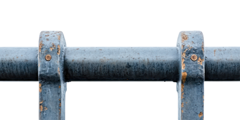 The image shows a close-up of a rusted blue metal pipe supported by two metal brackets.