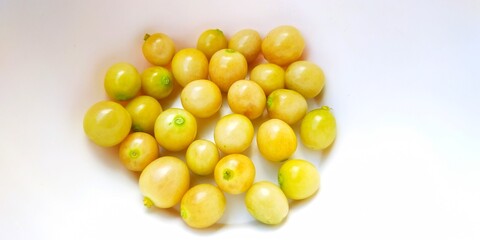 Physalis Angulata L or Cape Goosebery or Ciplukan fruit isolated in a bowl on a white background