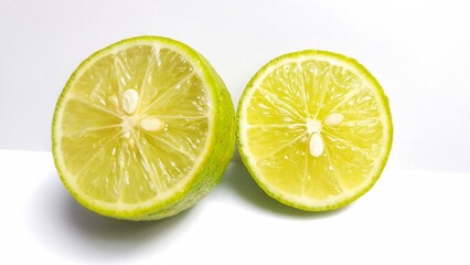 Close-up of lime slices on white background