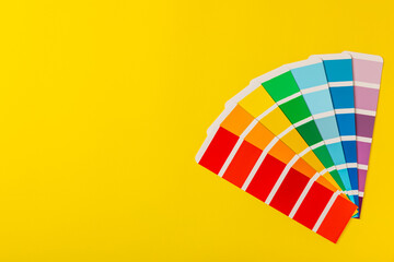 Color palette on a bright colored background. Color palette guide. paper catalog of rainbow color. creative.Palette, samples of trending colors. Color swatches. Decor and interior designer. Top view. 