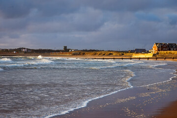 Beach Abstracts, scenes, sea foam, seaweed and footprints in the sand. 