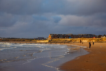Beach Abstracts, scenes, sea foam, seaweed and footprints in the sand. 