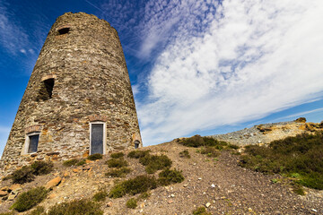 The remains of the Grade II Listed windmill atop Parys Mountain, opencast copper mine, Amlwch, Anglesey, Gwynedd