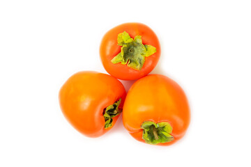 Persimmon isolated on white background. Persimmon fruit. Slice of ripe, juicy, sweet persimmon fruit. Vegan. Fruit garden. Close-up.