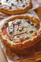 Tasty homemade delicious pizza served on a dinner table