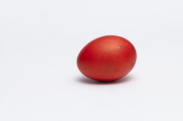 Homemade red Easter egg isolated on the white background